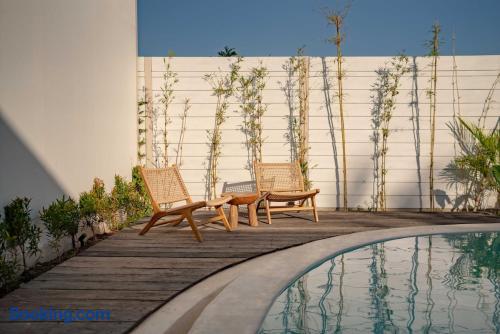 Private poolside retreat with stylish loungers and serene modern design