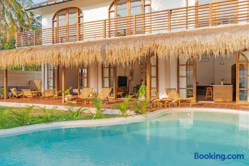 Tropical villa with private pool, shaded terrace, and resort-style lounging