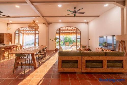 Sun-filled open living area with rustic charm and seamless patio access