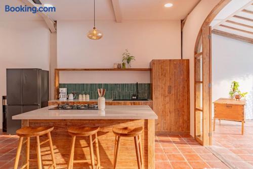 Bright designer kitchen with island seating and warm rustic charm