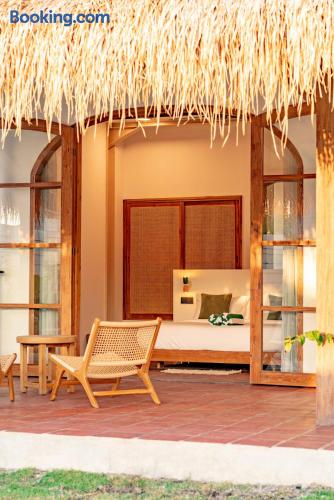Charming thatched bungalow with private terrace and open-air tropical feel