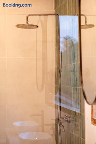Modern bathroom with rainfall shower and dual sinks