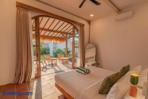 Sunlit bedroom with private patio and seamless indoor-outdoor feel
