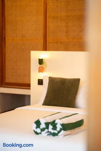 Cozy modern bedroom with warm lighting and crisp, hotel-style bedding
