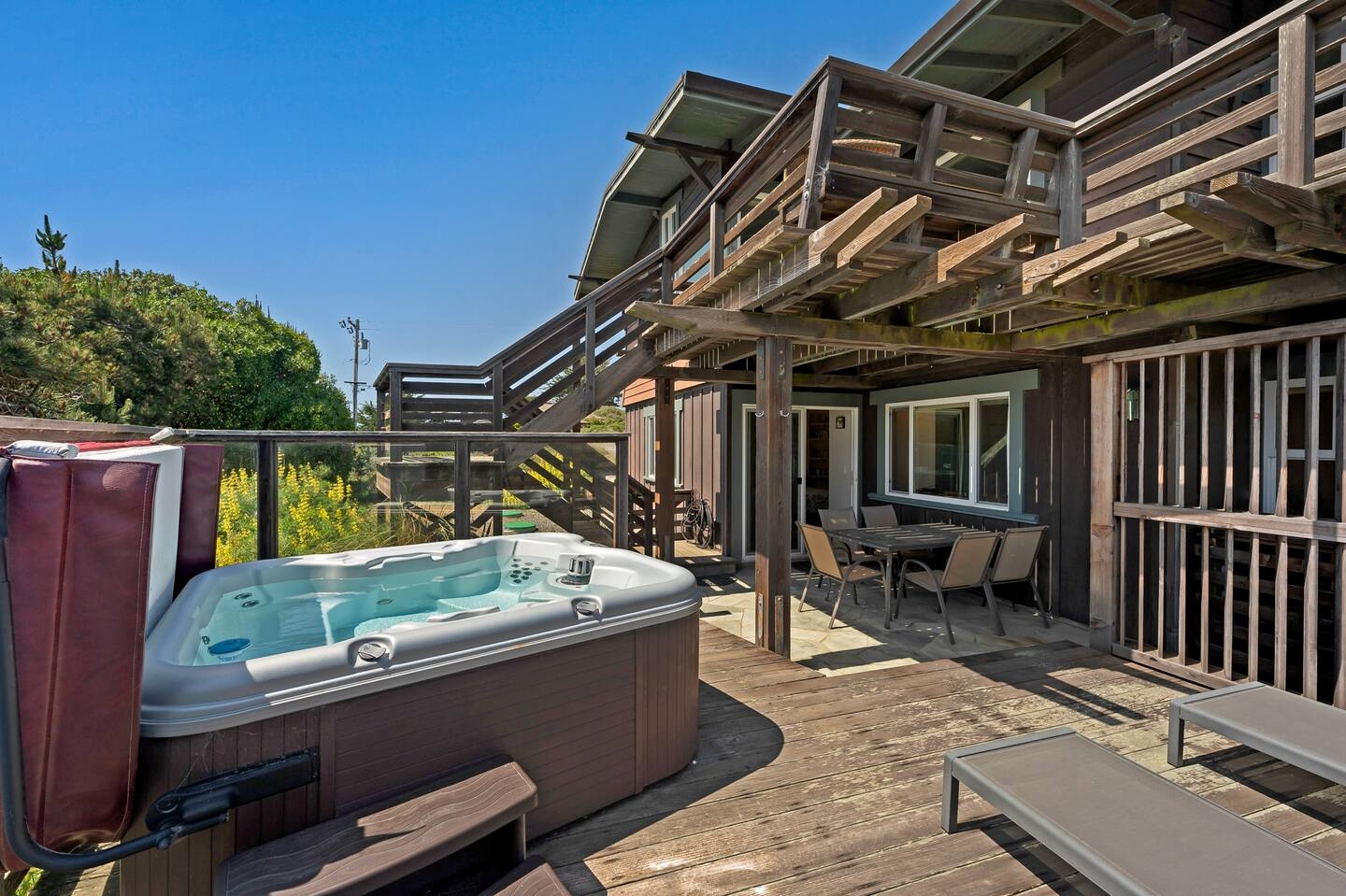 Private hot tub and spacious deck for relaxing outdoor living