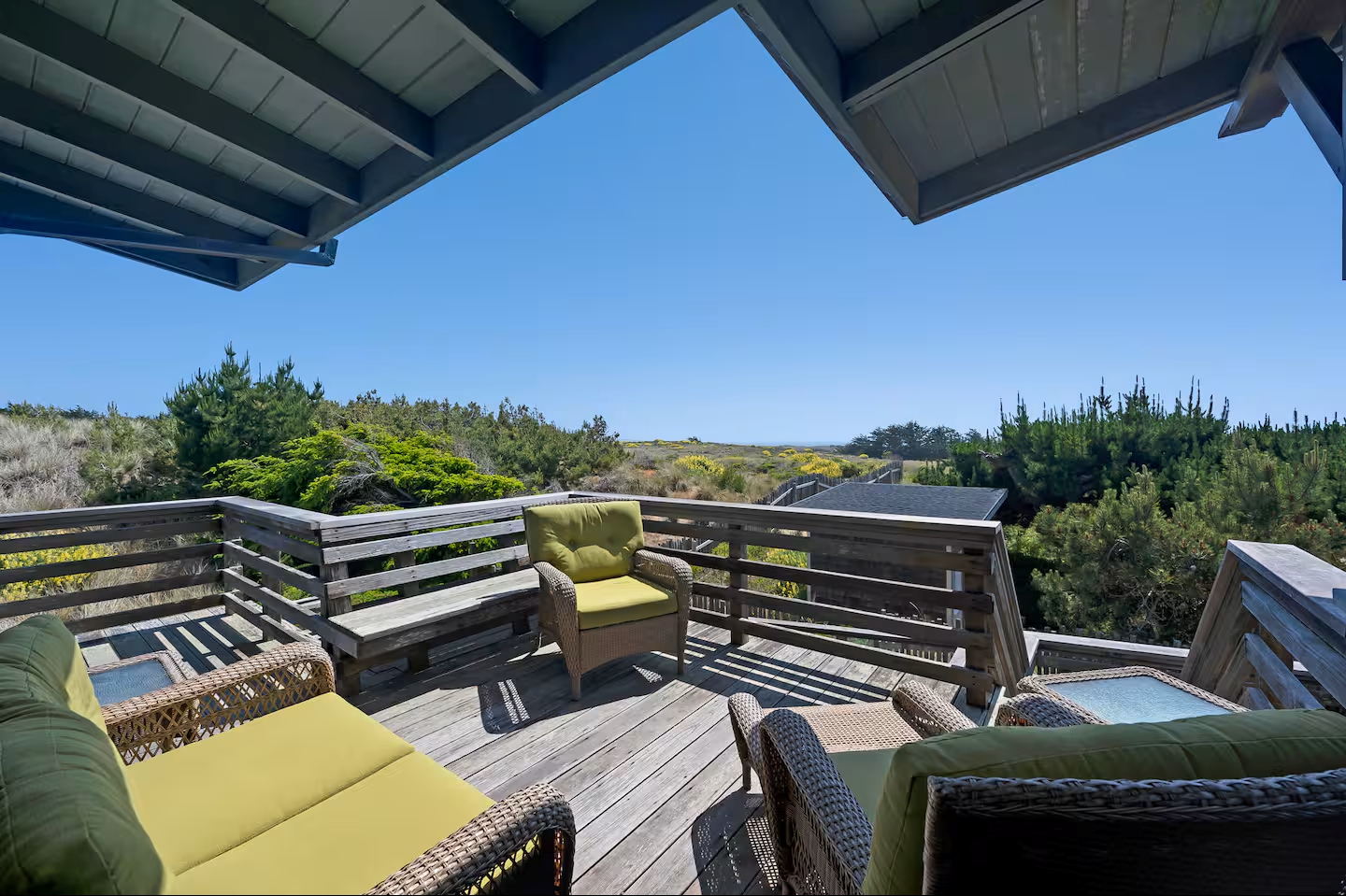 Sunny private deck with cushioned seating and peaceful nature views