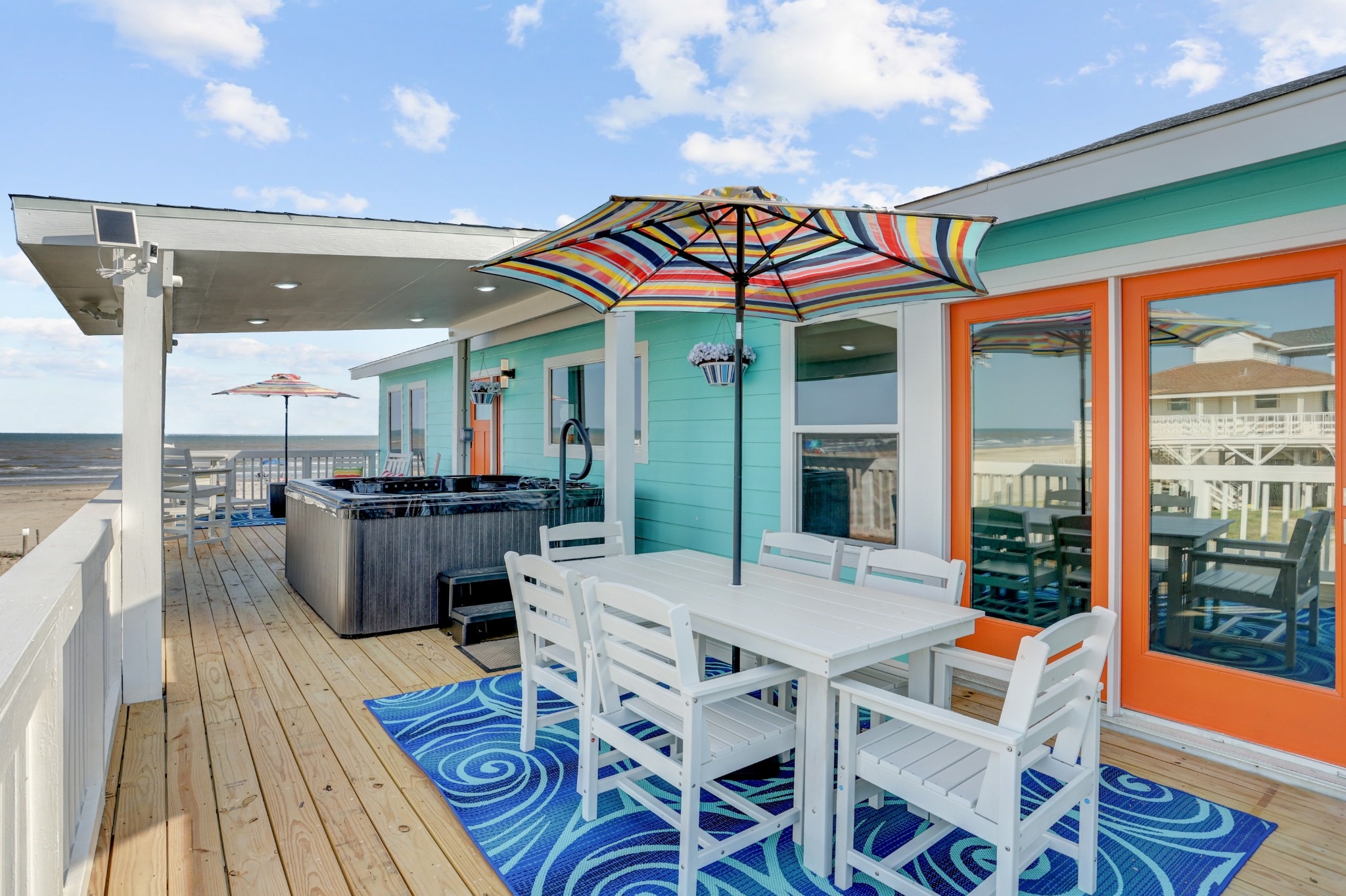Outdoor deck with dining and hot tub