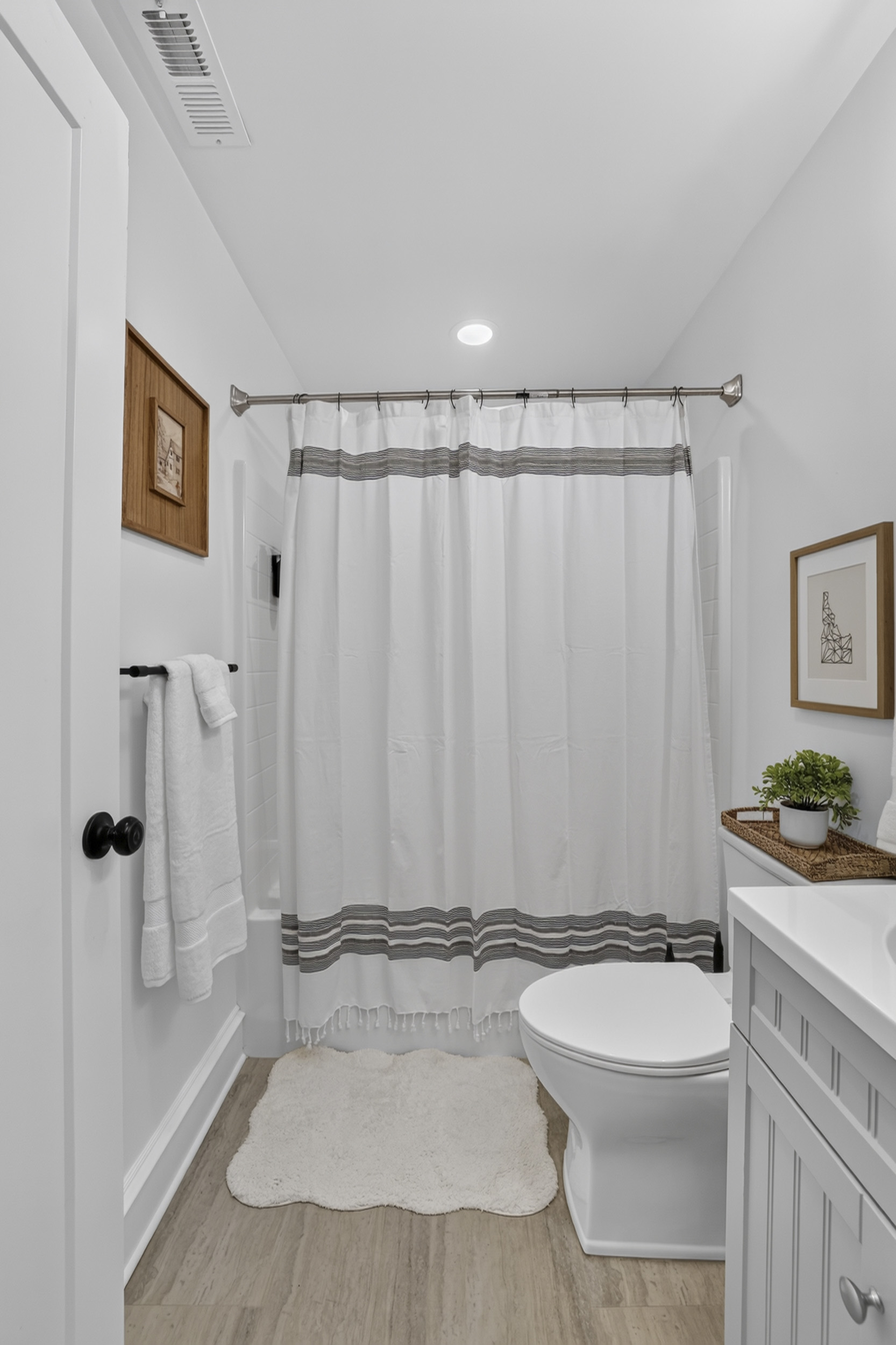Bright, modern bathroom with airy design and stylish gray accents