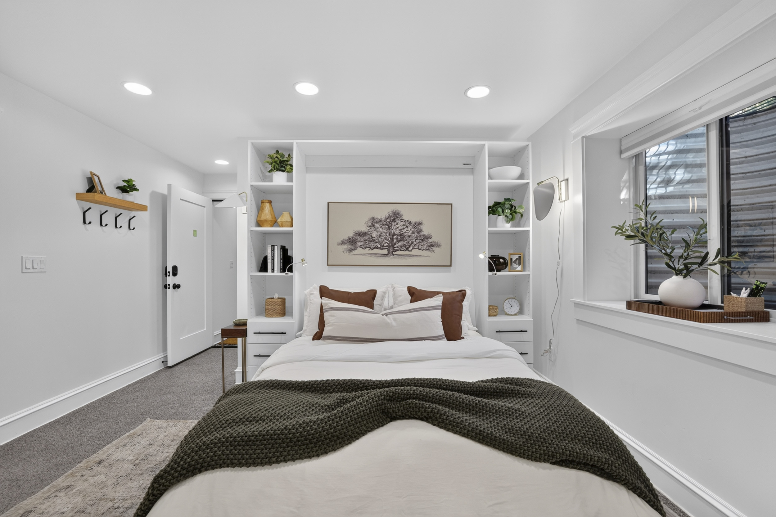 Bright, cozy bedroom with built-ins, soft neutrals, and modern charm