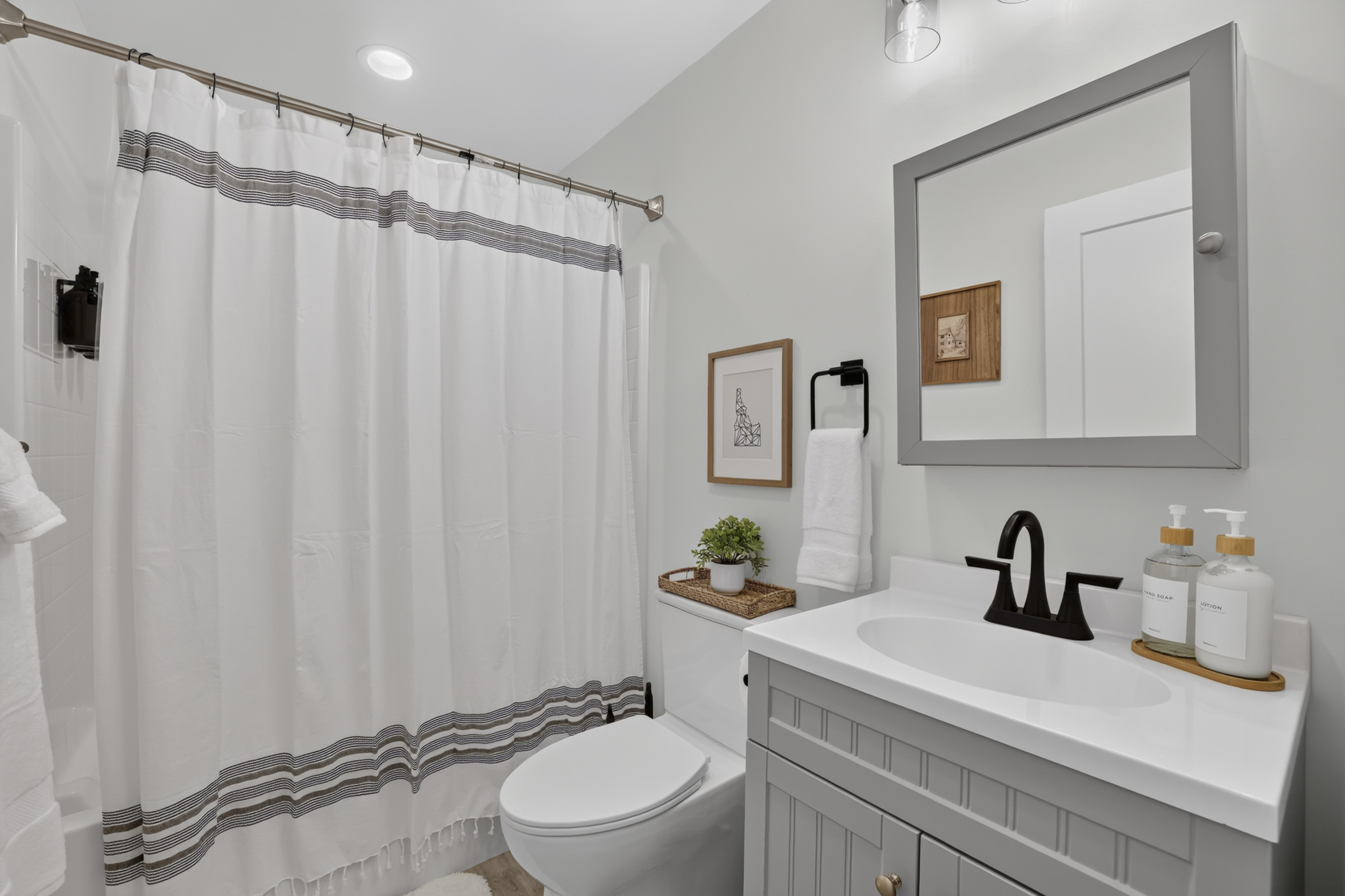 Bright modern bathroom with sleek vanity and fresh, spa-like touches
