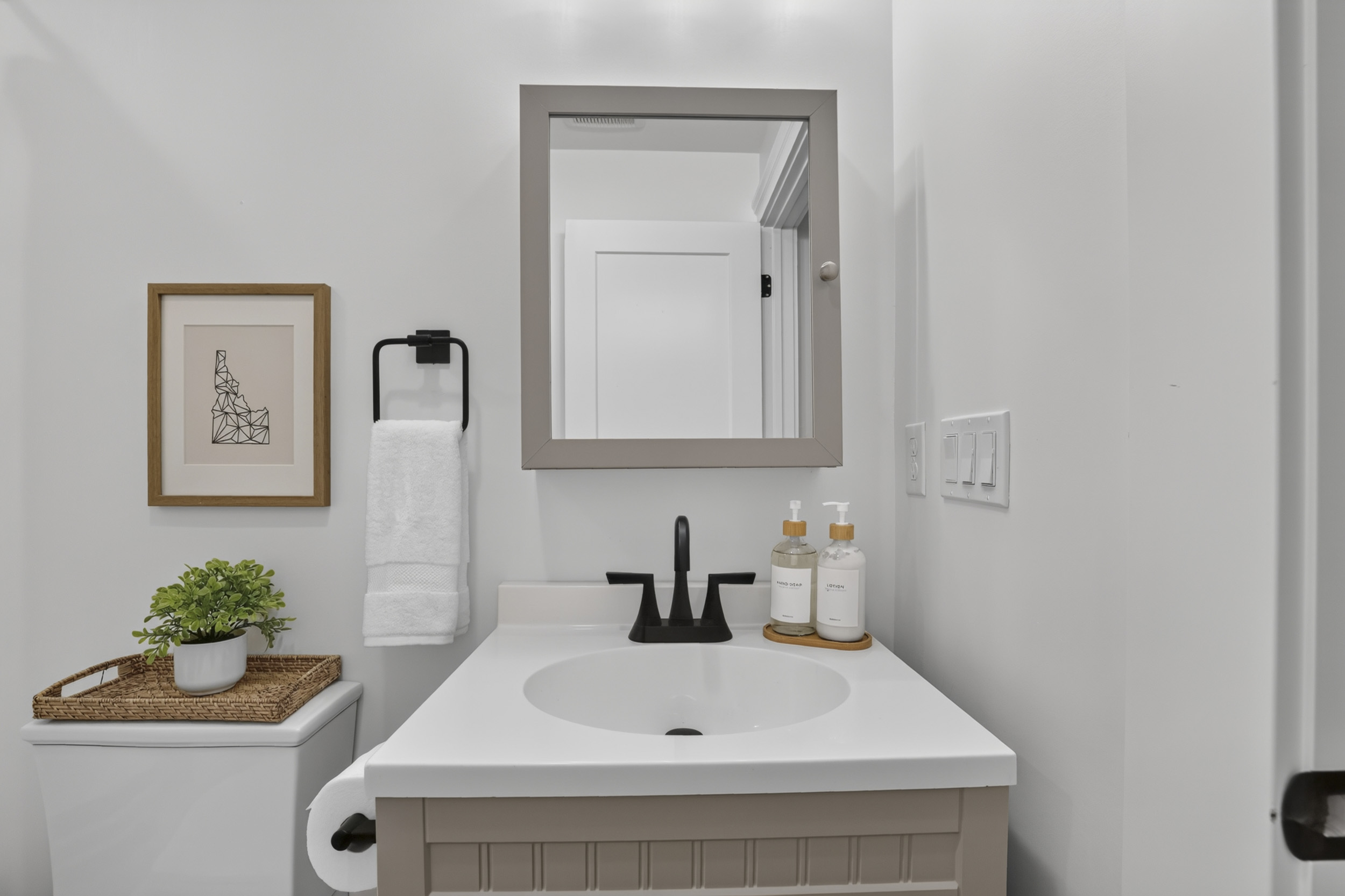 Bright modern bathroom with sleek vanity and stylish black fixtures