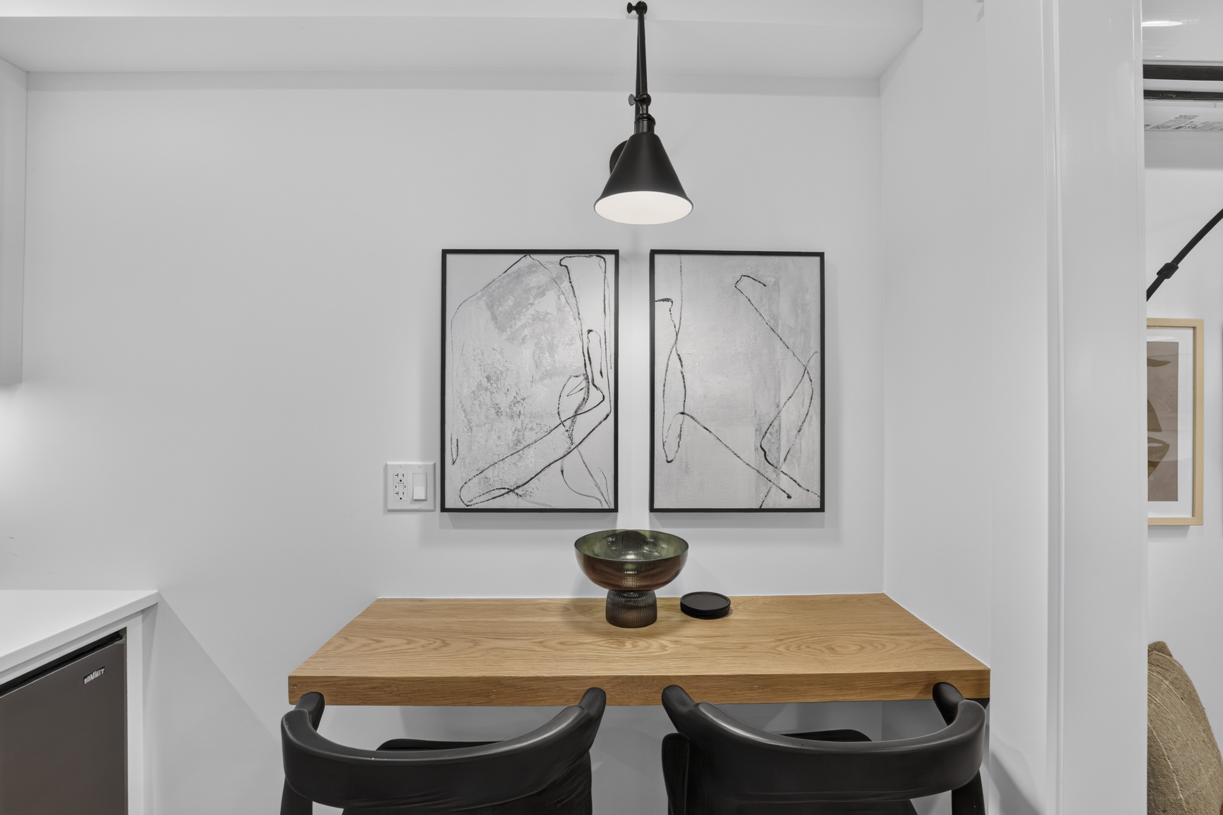 Modern breakfast nook with designer touches and cozy seating for two