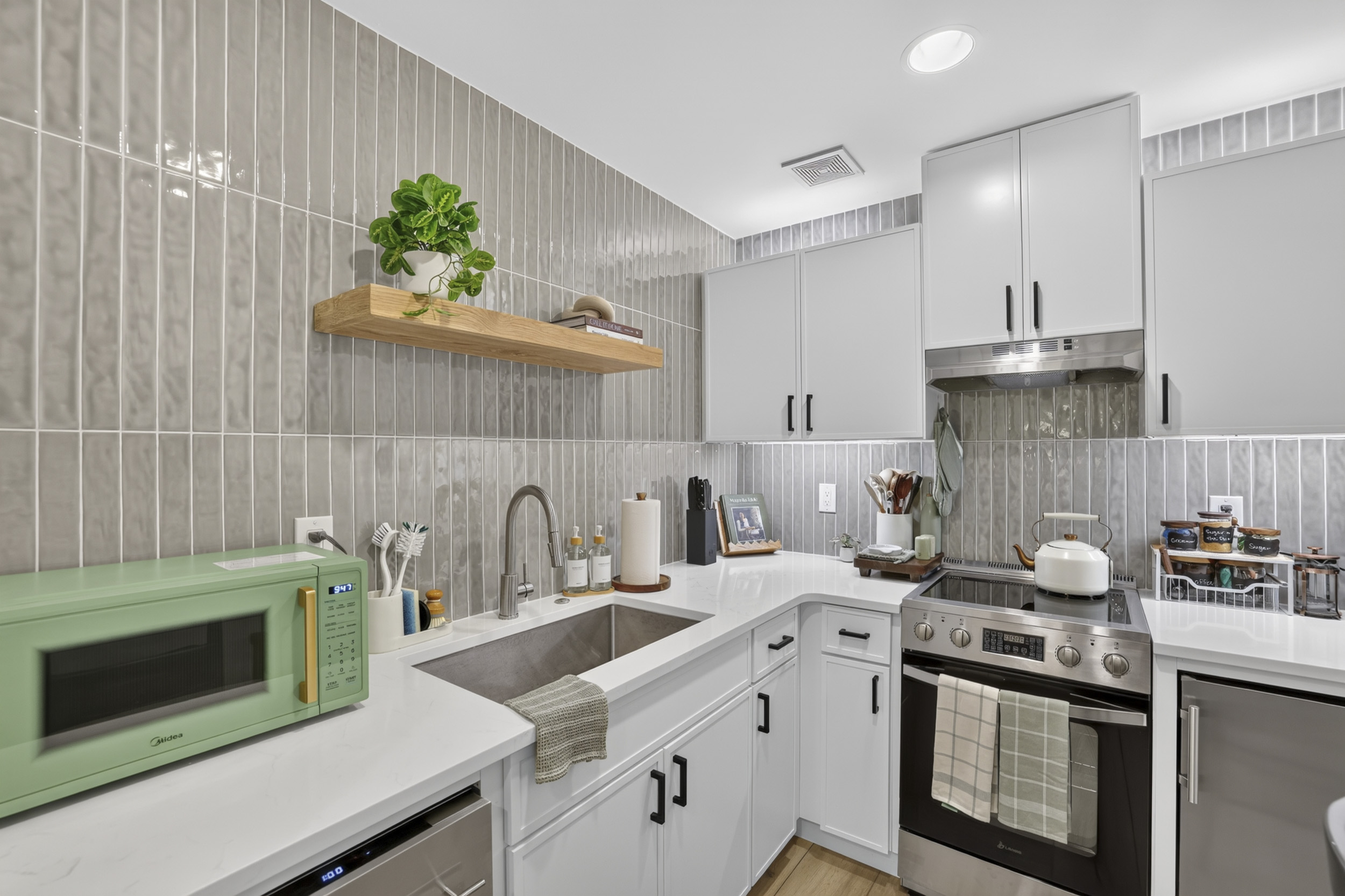 Stylish modern kitchen with sleek finishes and stainless steel appliances
