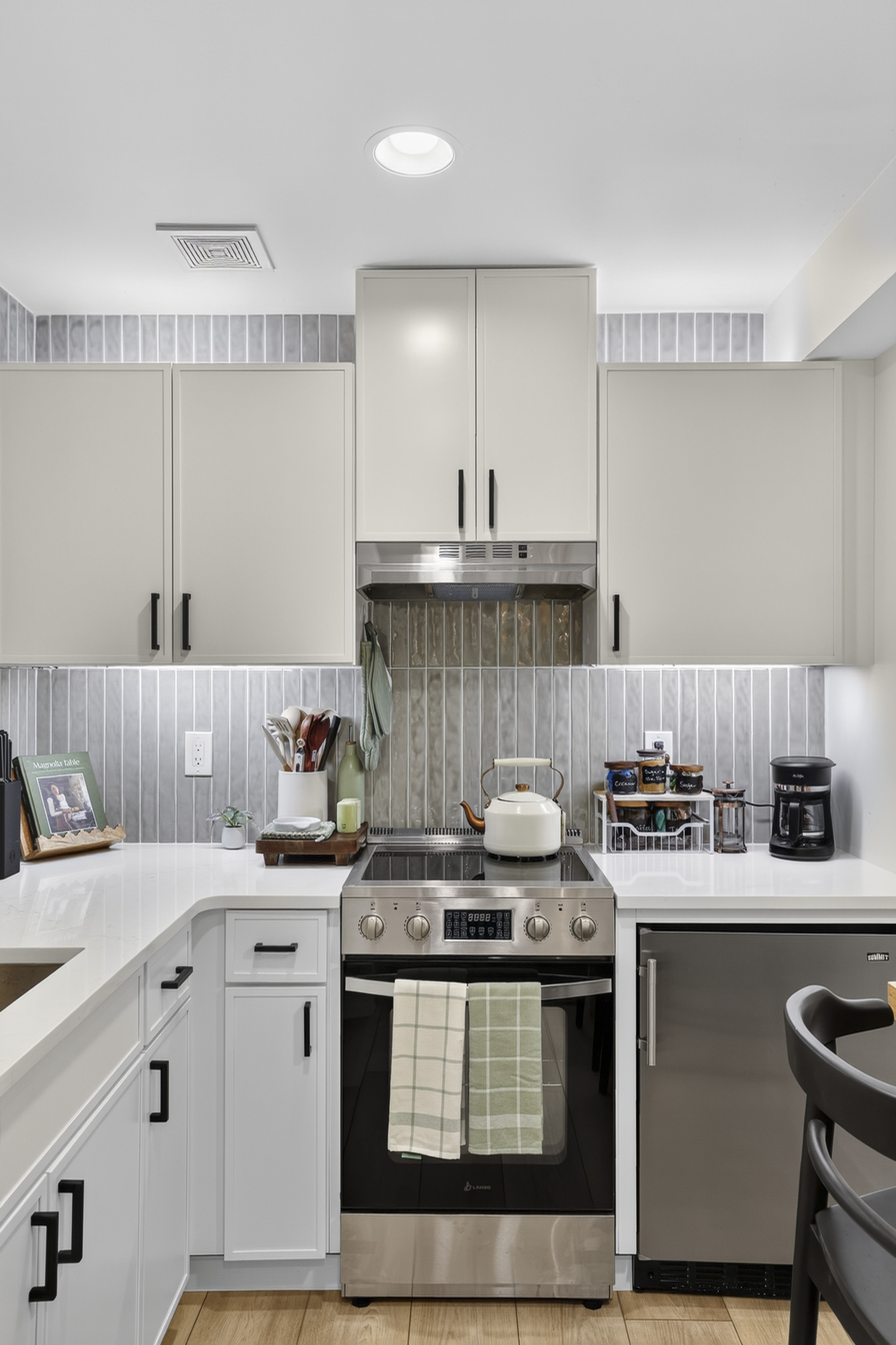 Bright modern kitchen with sleek finishes and stainless appliances