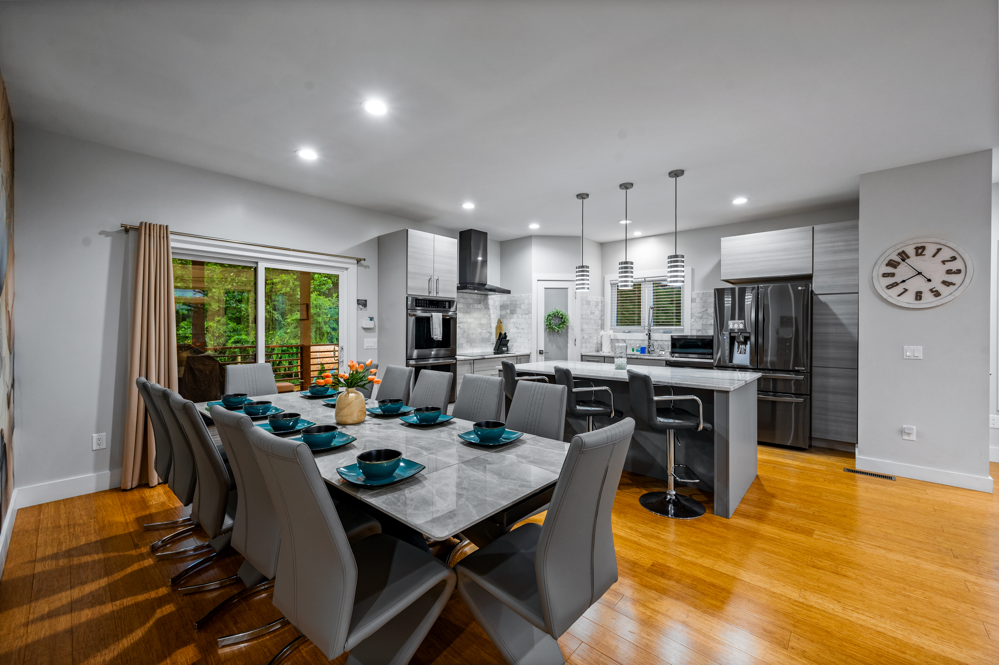 Modern open kitchen and dining space at a Wolfe Vacation Rentals home