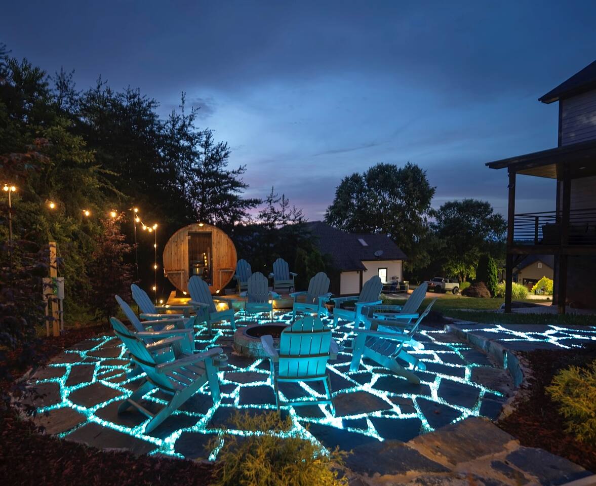 Ashe & Ember glowing fire pit patio at dusk