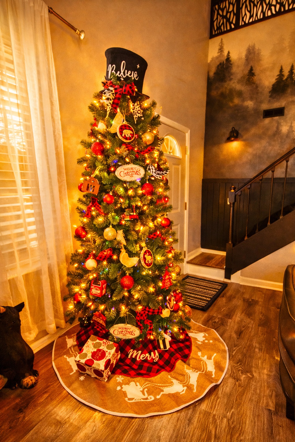 Cozy entryway with a glowing Christmas tree and warm holiday charm
