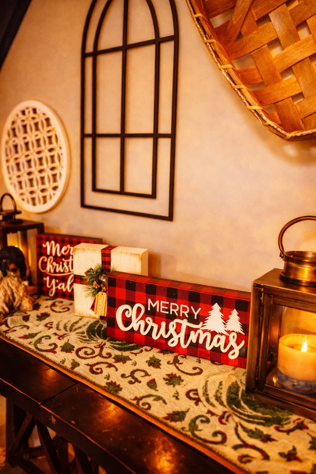 Cozy holiday entry table with warm candlelight and festive charm