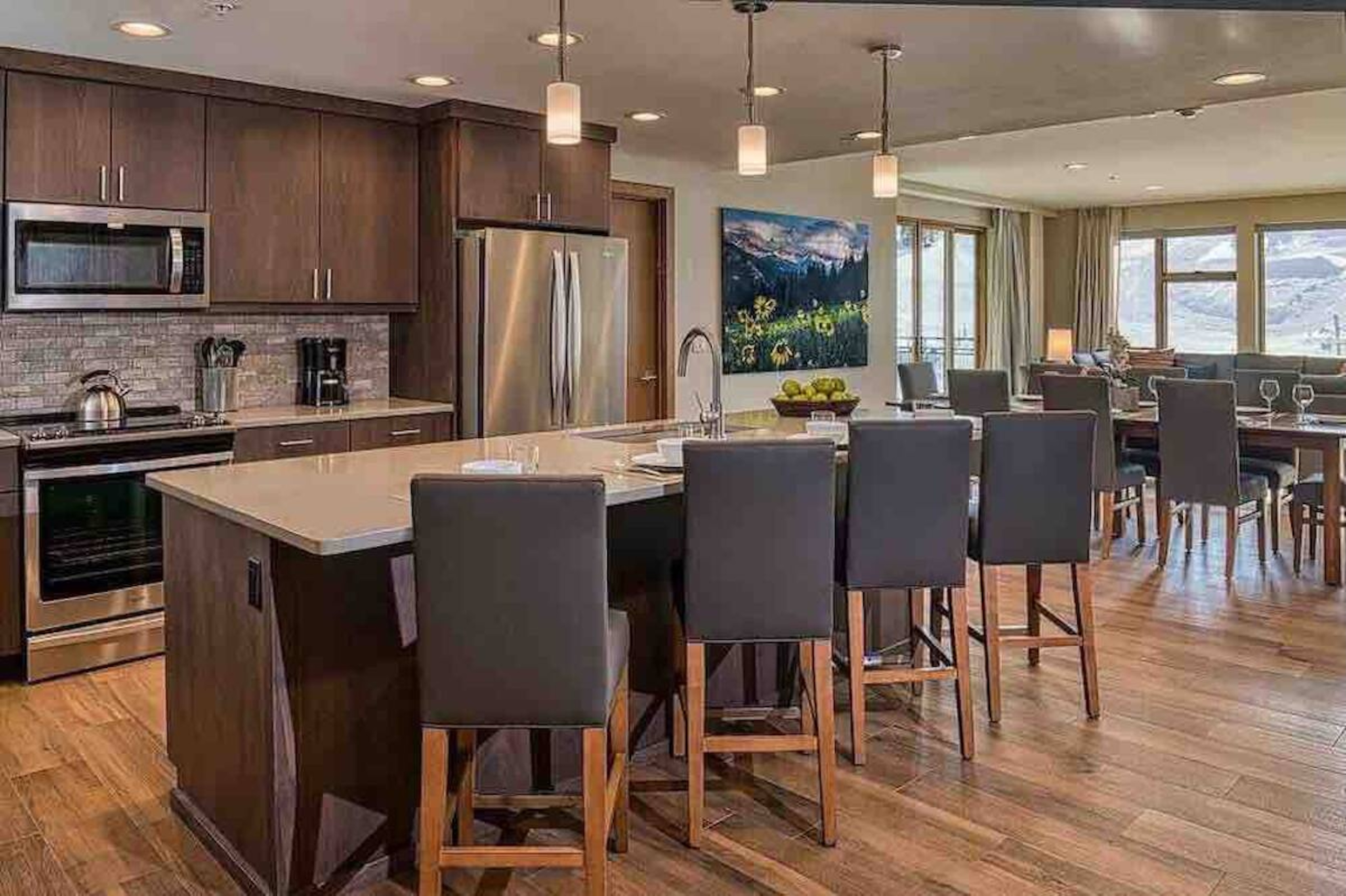 Spacious gourmet kitchen with island seating and scenic mountain views
