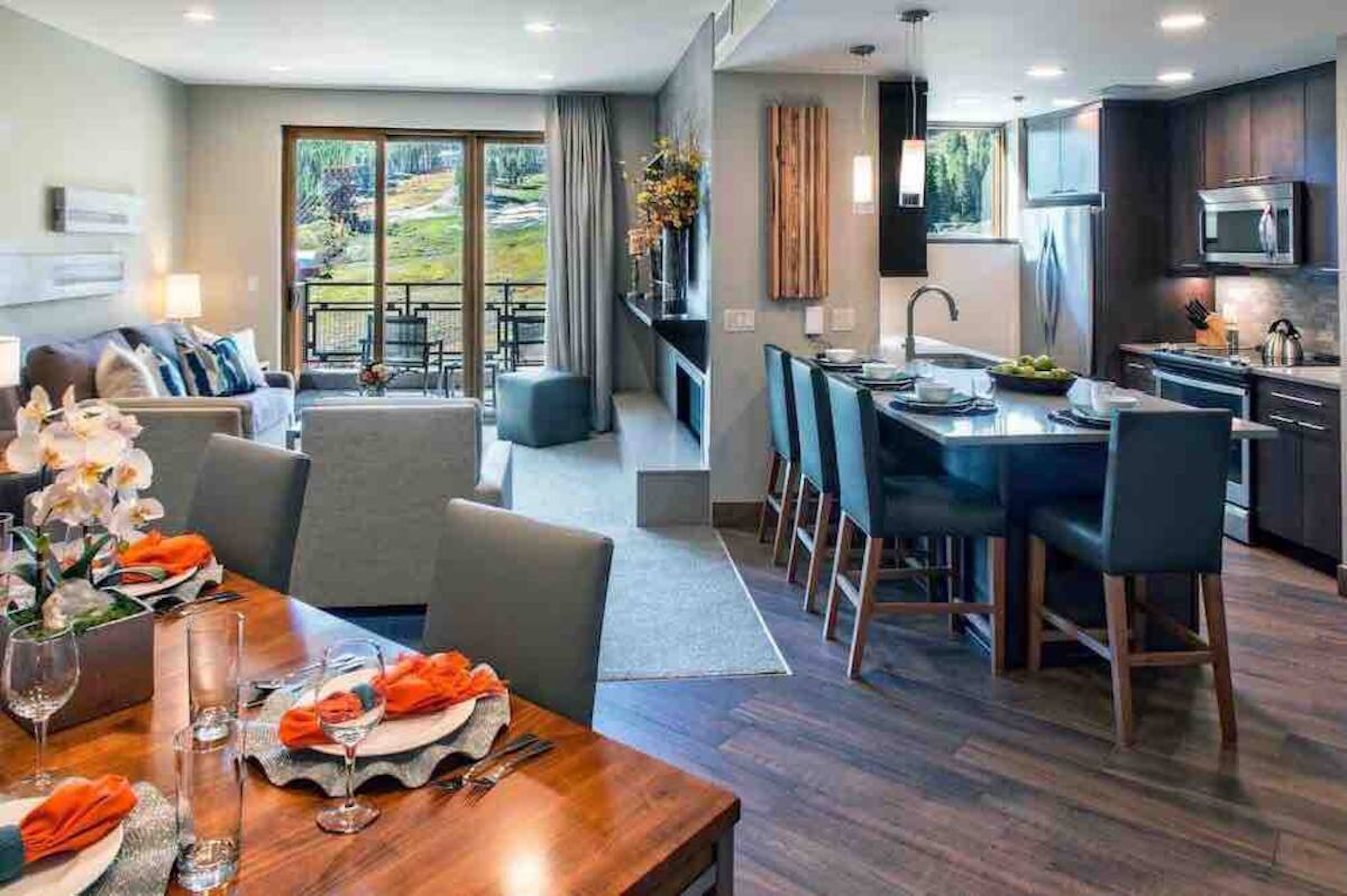 Modern open-concept retreat with balcony views and a spacious kitchen