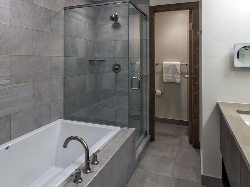 Spa-style bathroom with soaking tub and spacious glass walk-in shower