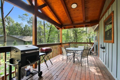 Fire up the grills and gather on your private covered deck, where forest views set the scene for alfresco dining — the ultimate outdoor space for savoring mountain evenings with family and friends.