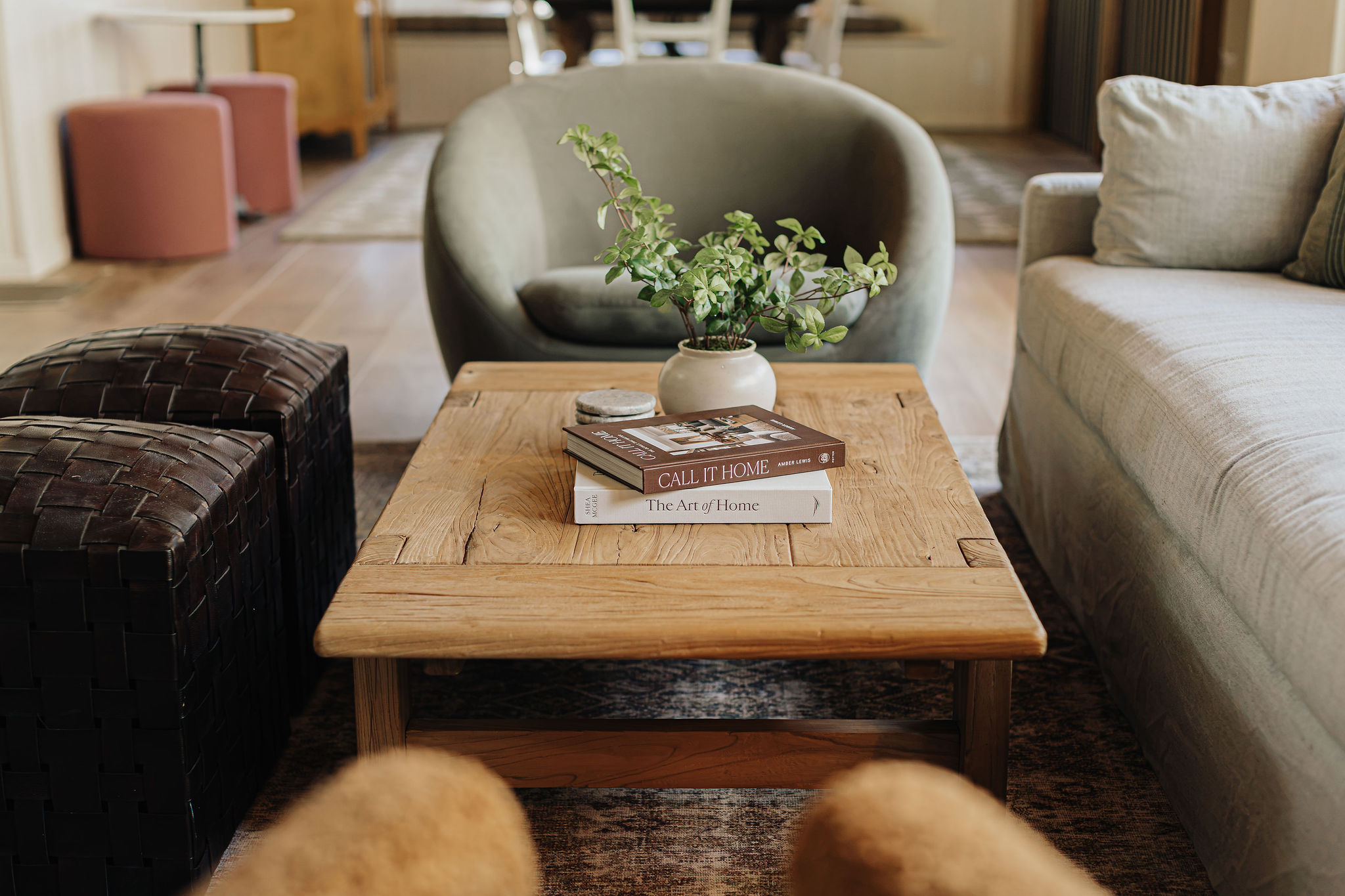Cozy designer living room with rustic wood table and plush seating