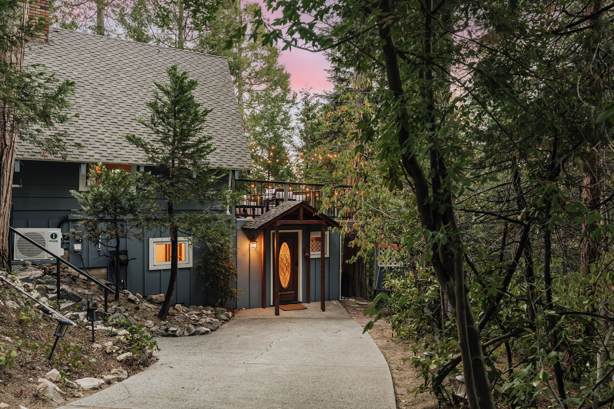 Secluded woodland cabin with warm entry, private drive, and scenic deck