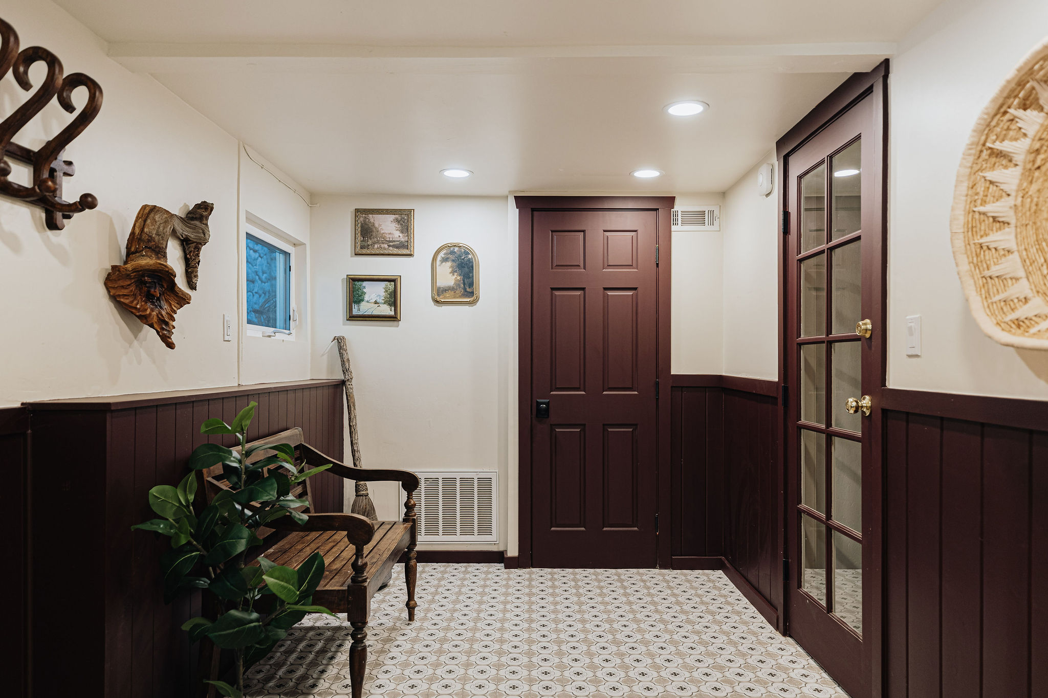Charming entryway with vintage character, warm wood accents, and stylish decor