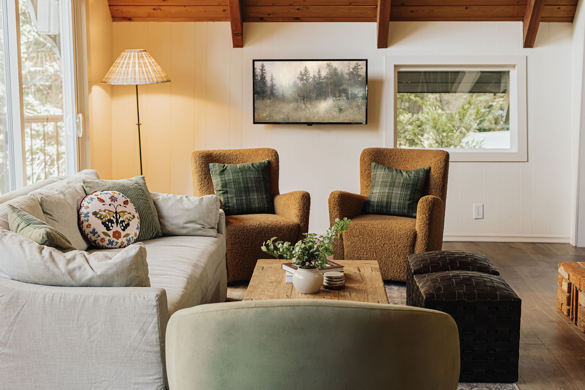 Cozy, light-filled living room with rustic charm and comfy seating