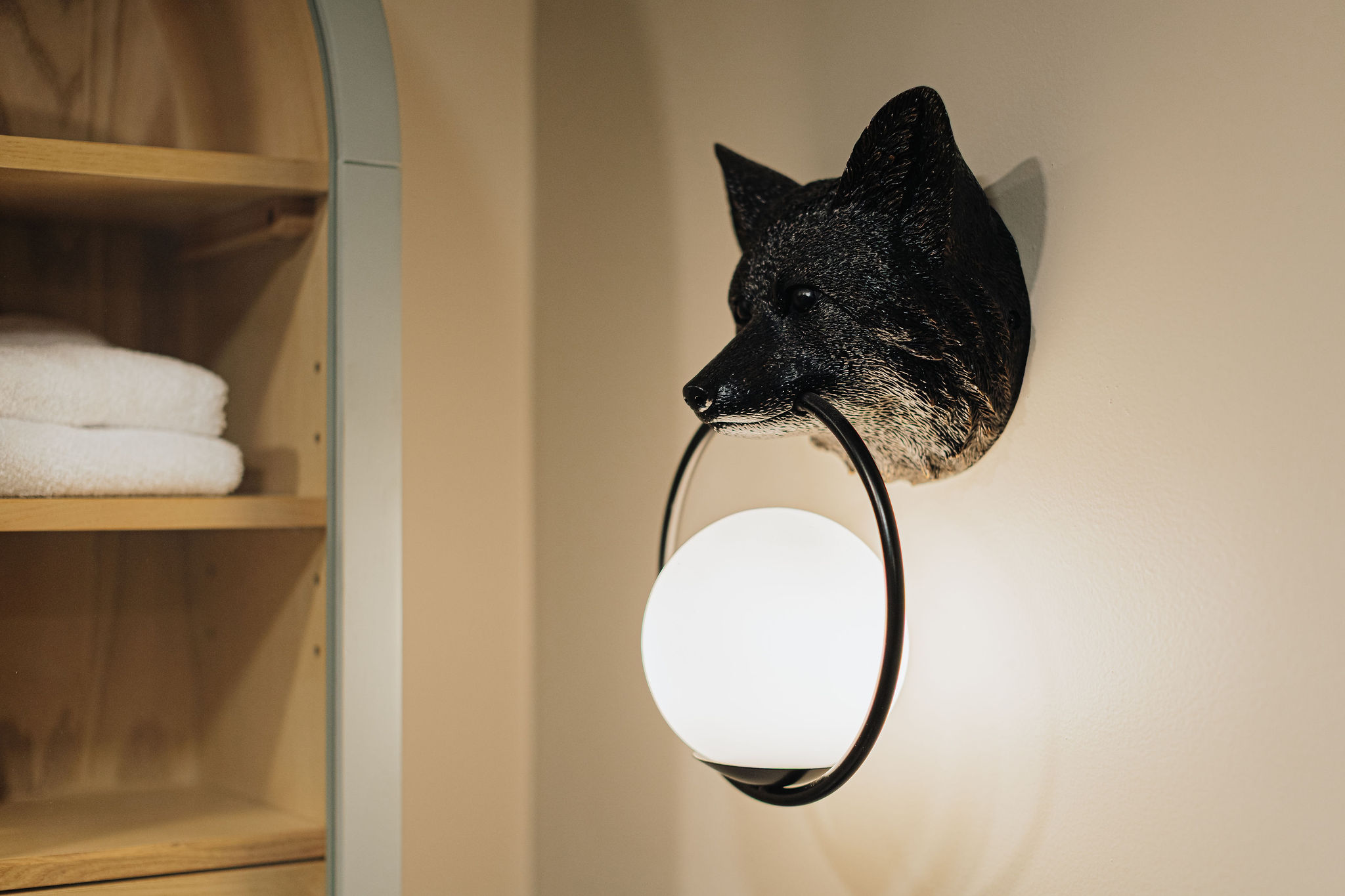 Charming designer lighting and fresh towels for a cozy, curated stay