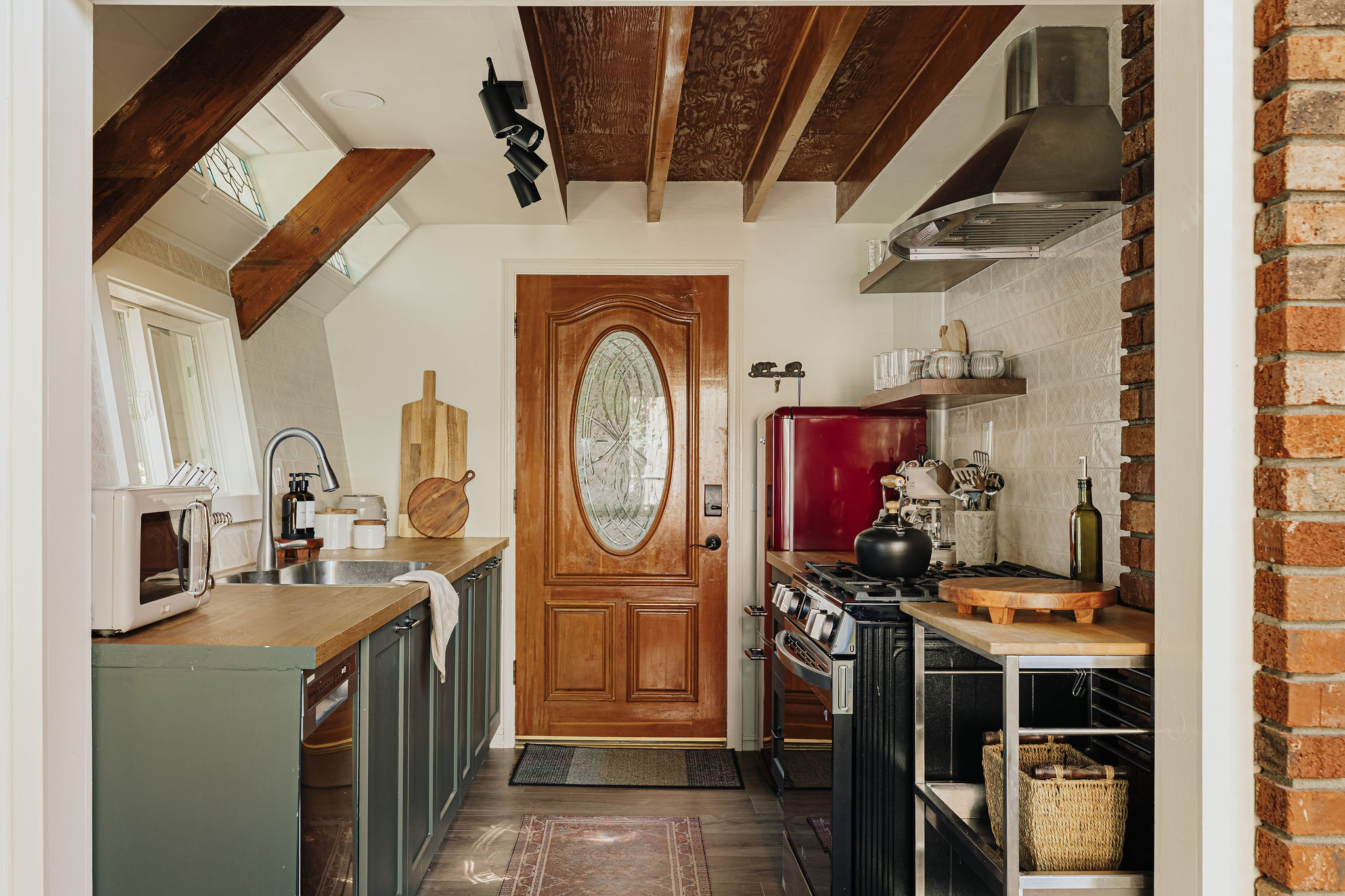 Cozy rustic kitchen with exposed beams and charming vintage touches