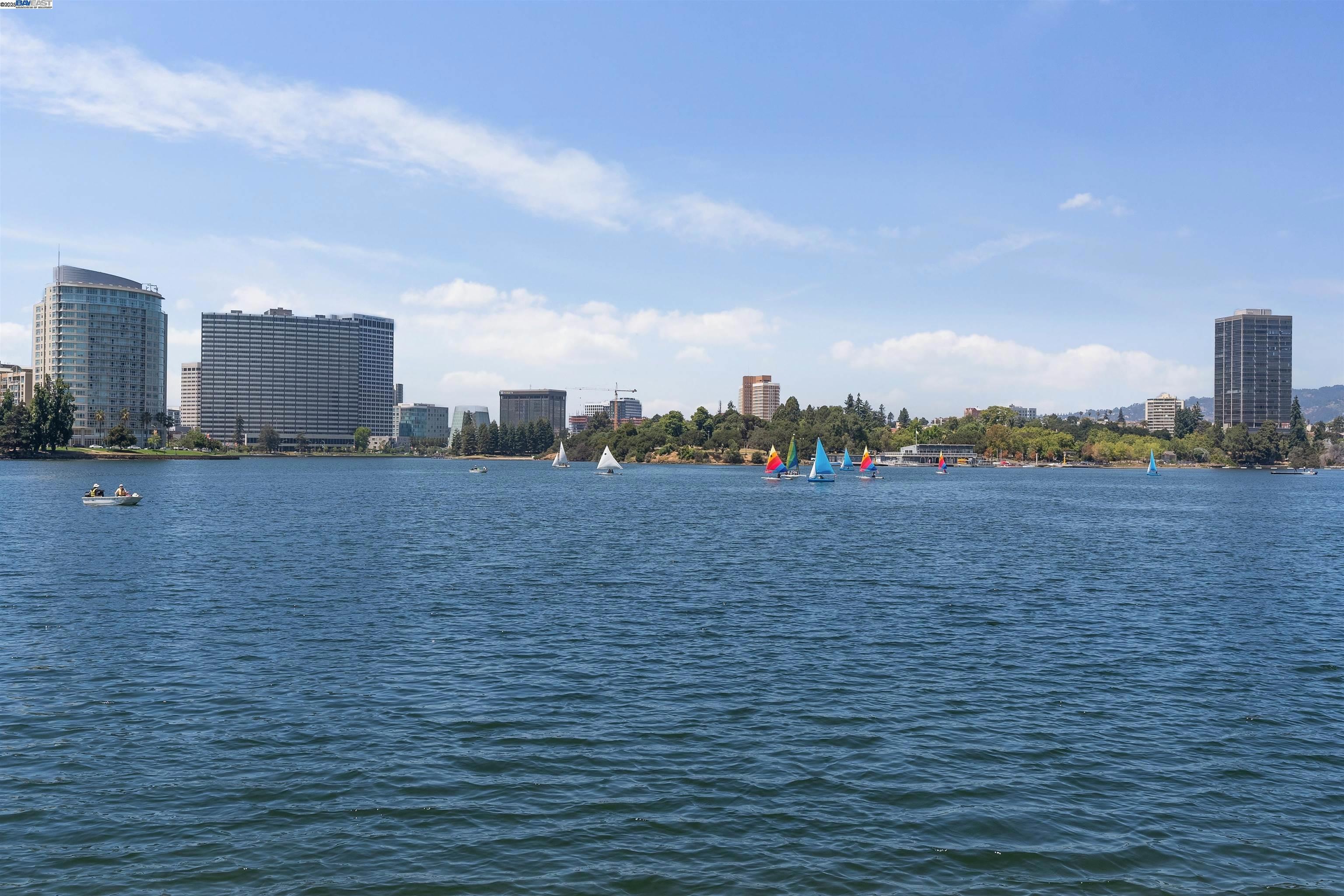 Scenic lake views with sailboats and a vibrant city skyline