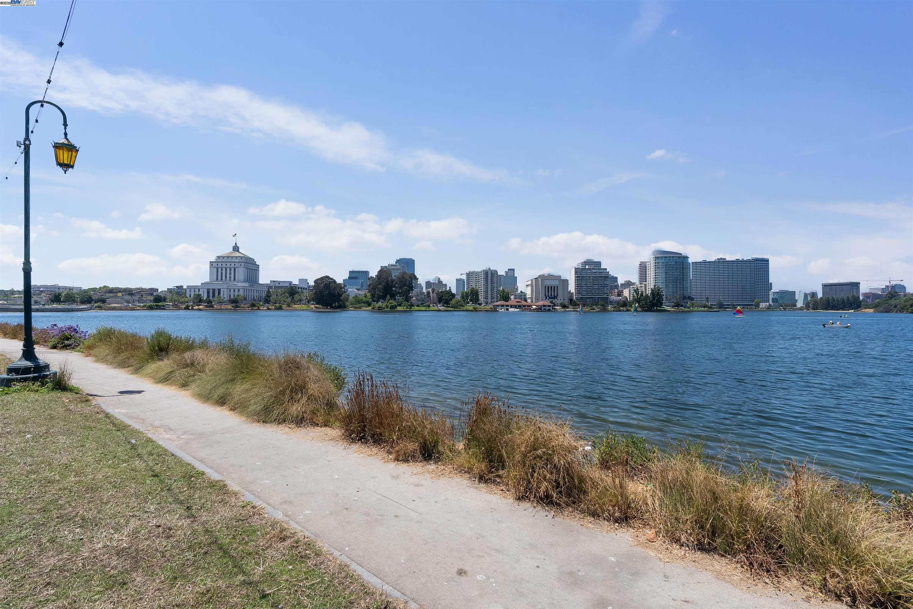 Scenic lakeside path with skyline views and peaceful waterfront setting