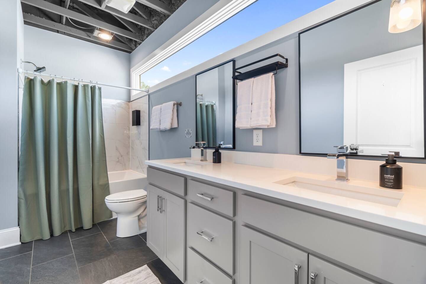 Bright modern bathroom with dual sinks and spacious vanity