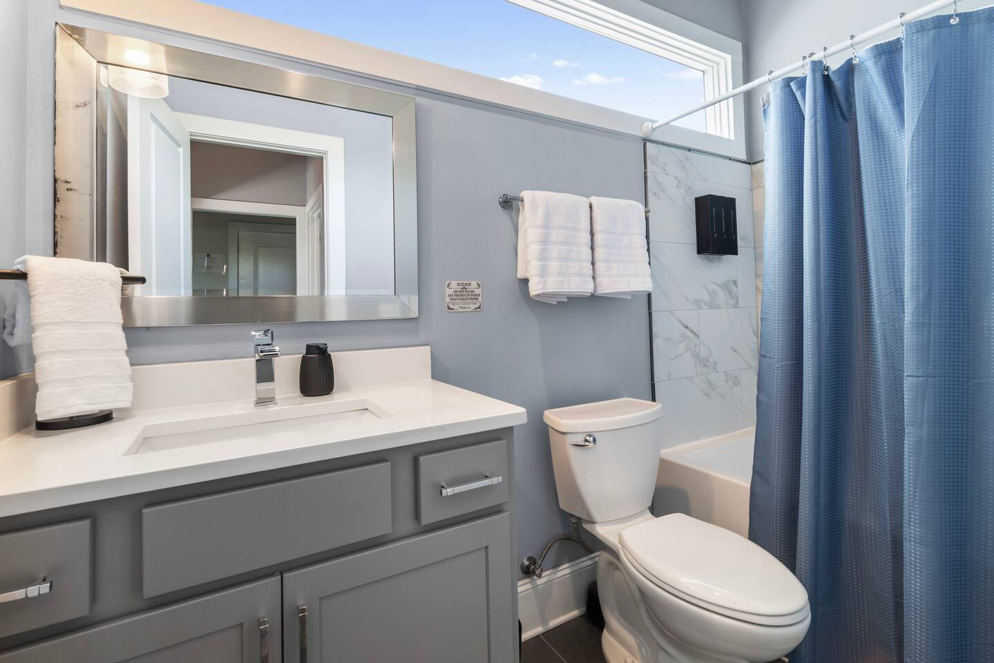 Bright modern bathroom with sleek vanity and fresh hotel-style touches