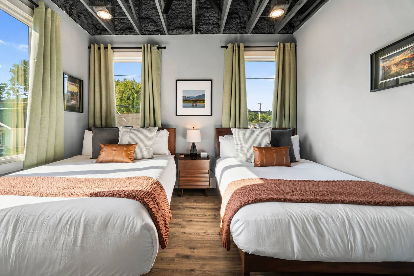 Enjoy a comfortable night’s rest in this inviting bedroom with one queen bed and one full bed