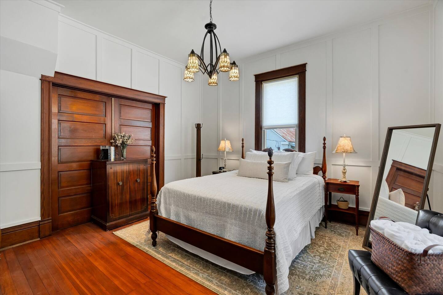 Master bedroom with queen size antique bed and attached bath