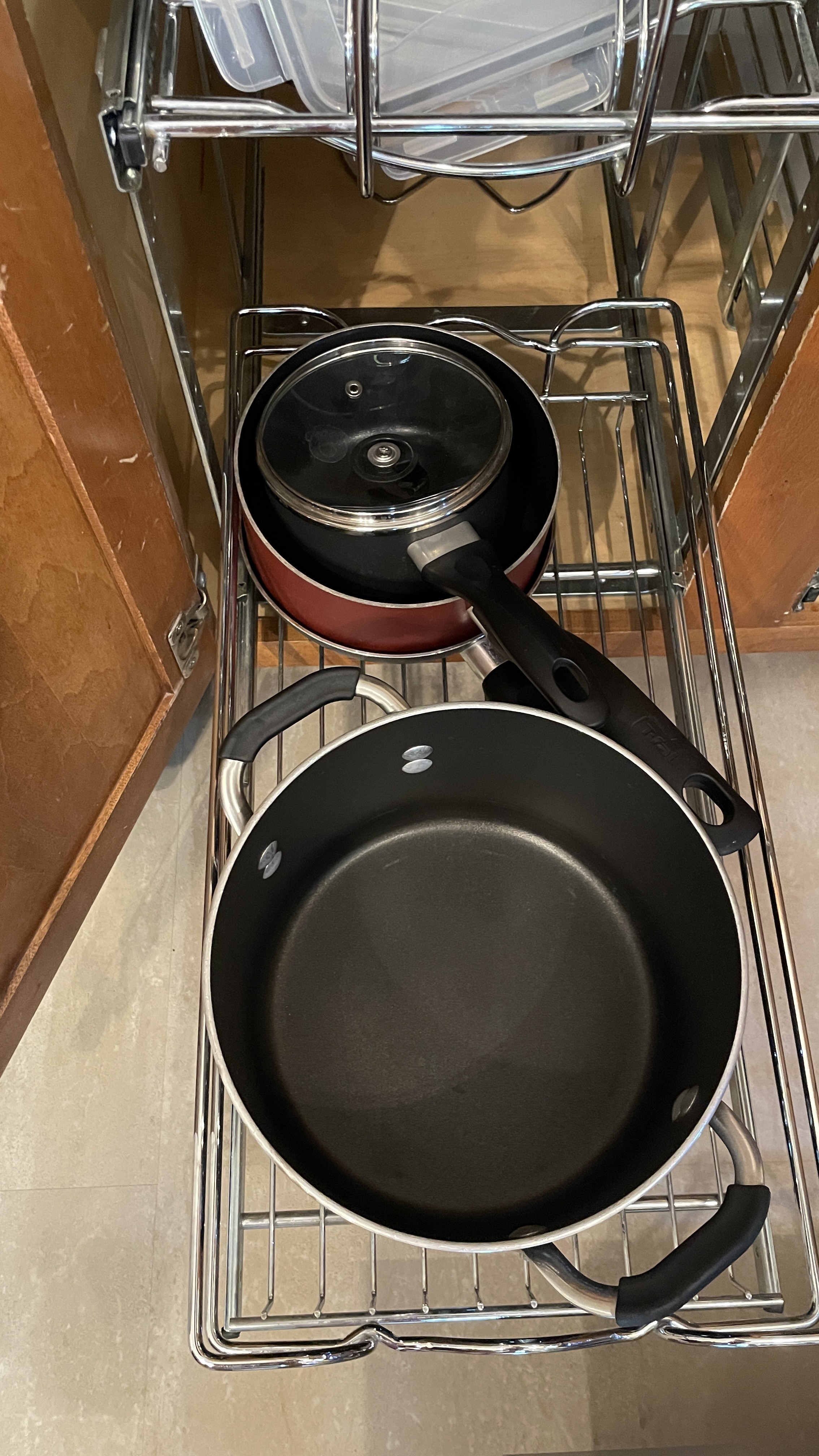 Well-stocked kitchen with organized pots, pans, and easy-access storage