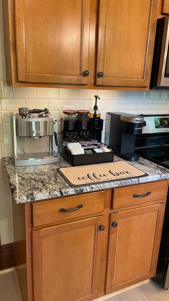 Coffee and tea bar. Grind your own for use in the Espresso machine or use the Keurig pods. Standard coffee maker is available in the cabinet.