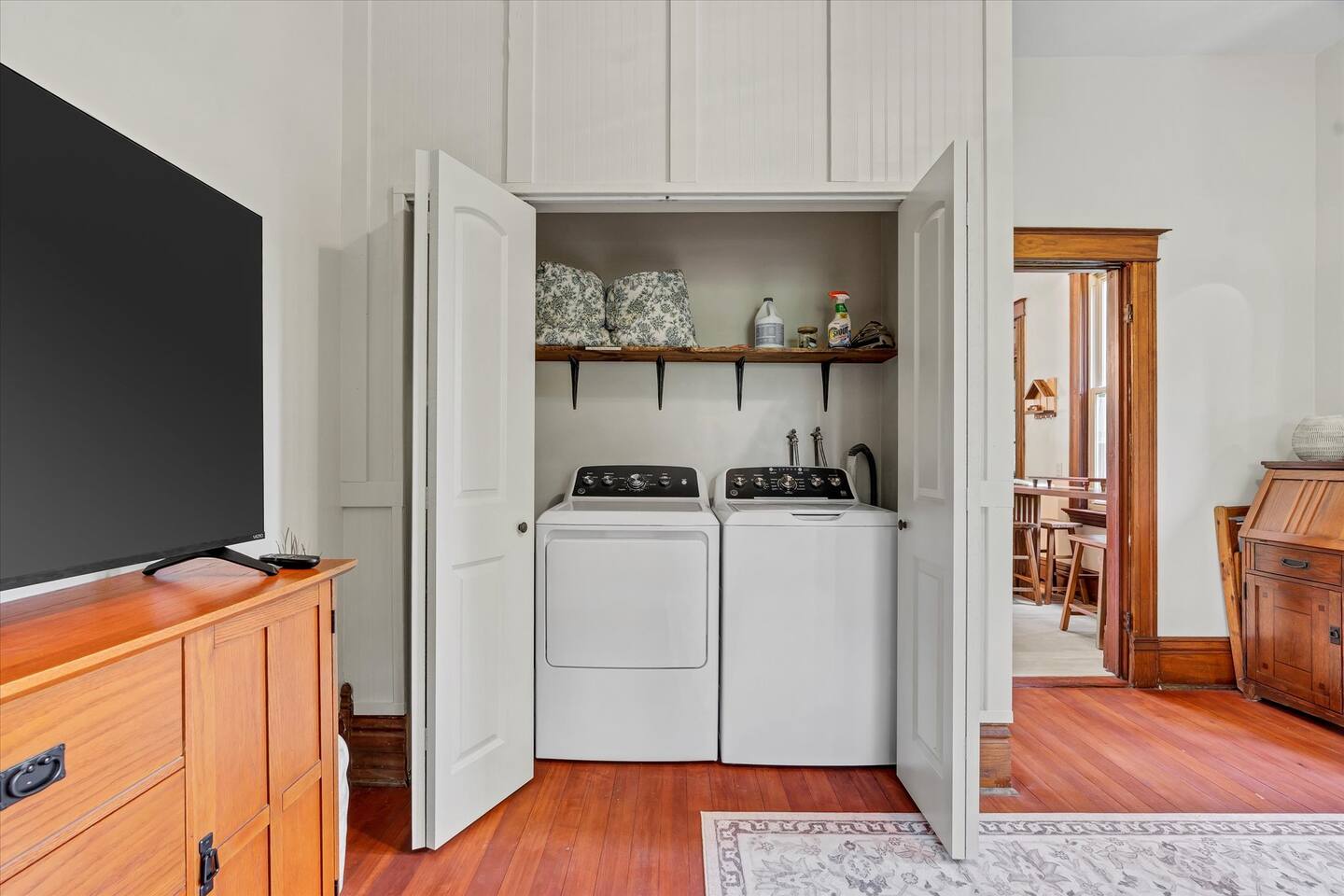 Washer and dryer in the living room - detergent provided