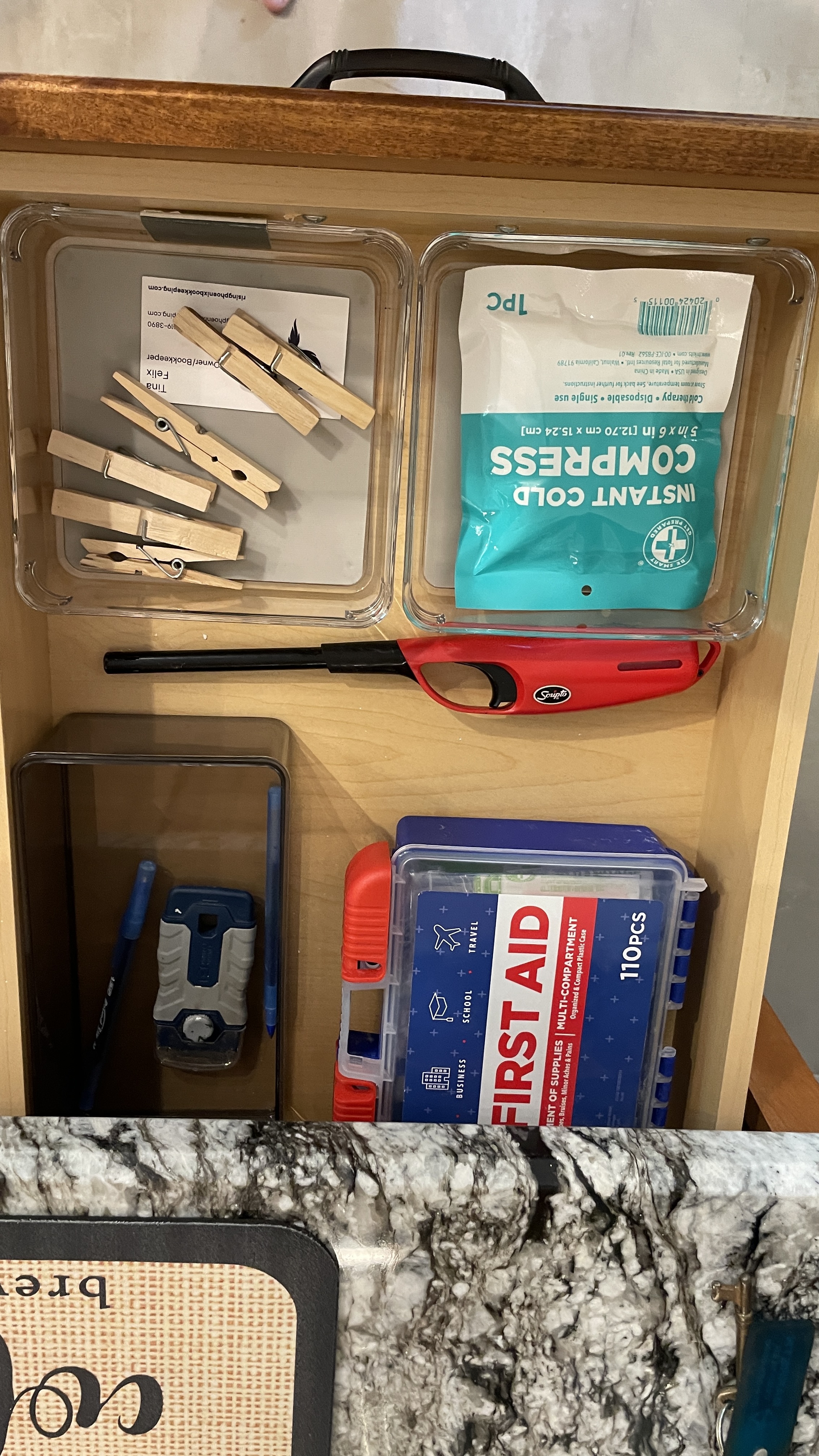 Well-stocked essentials drawer with first aid kit and handy guest supplies