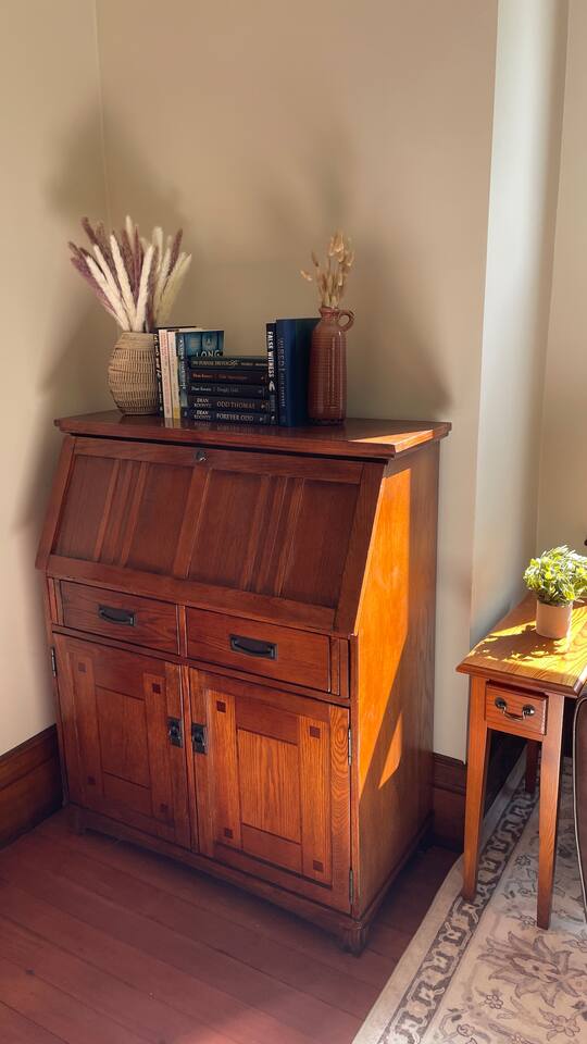Dedicated workspace - Secretary desk opens up for a desk surface.