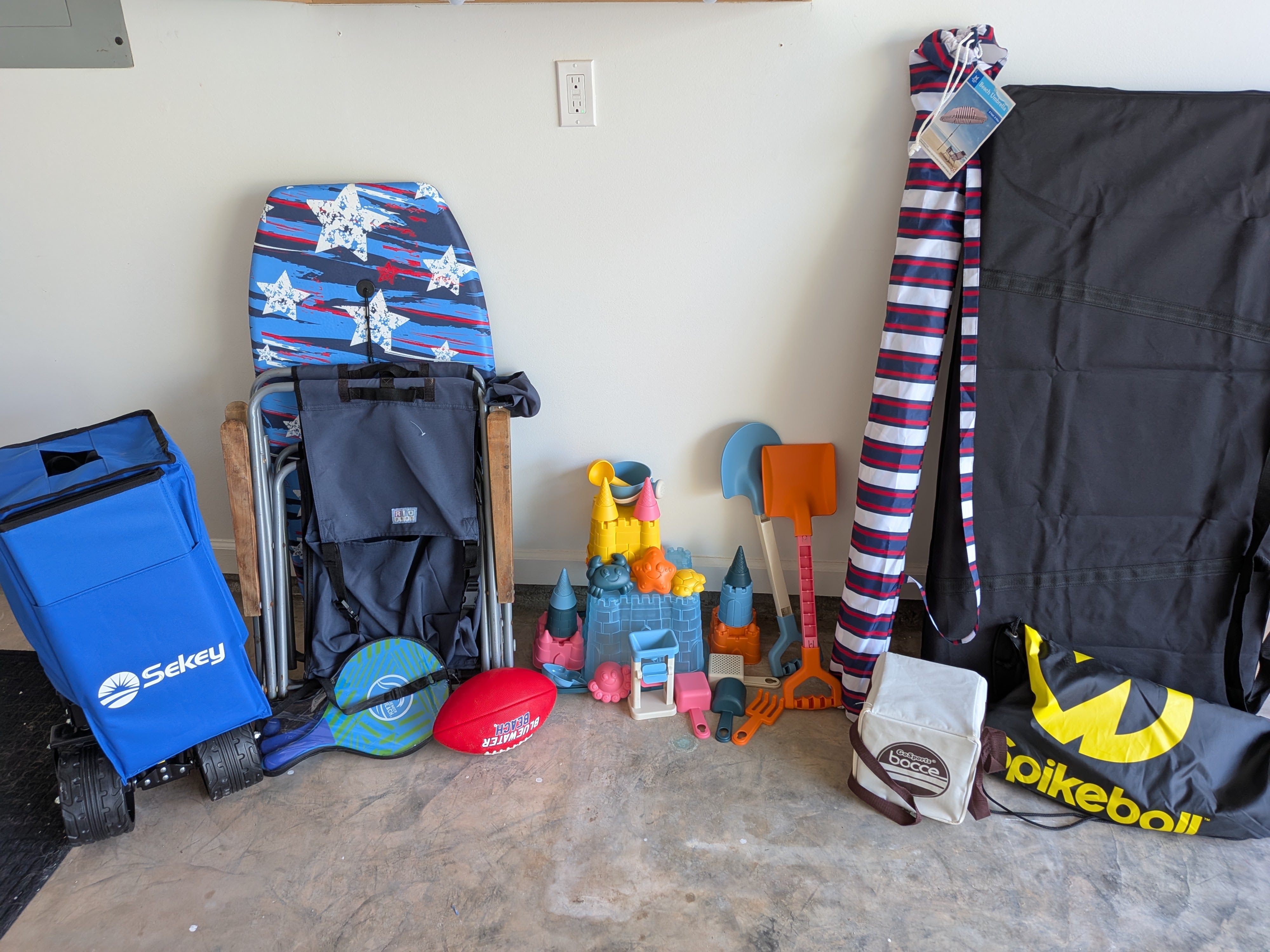 Beach gear, sand toys, bocce ball, spike balls, & corn hole.