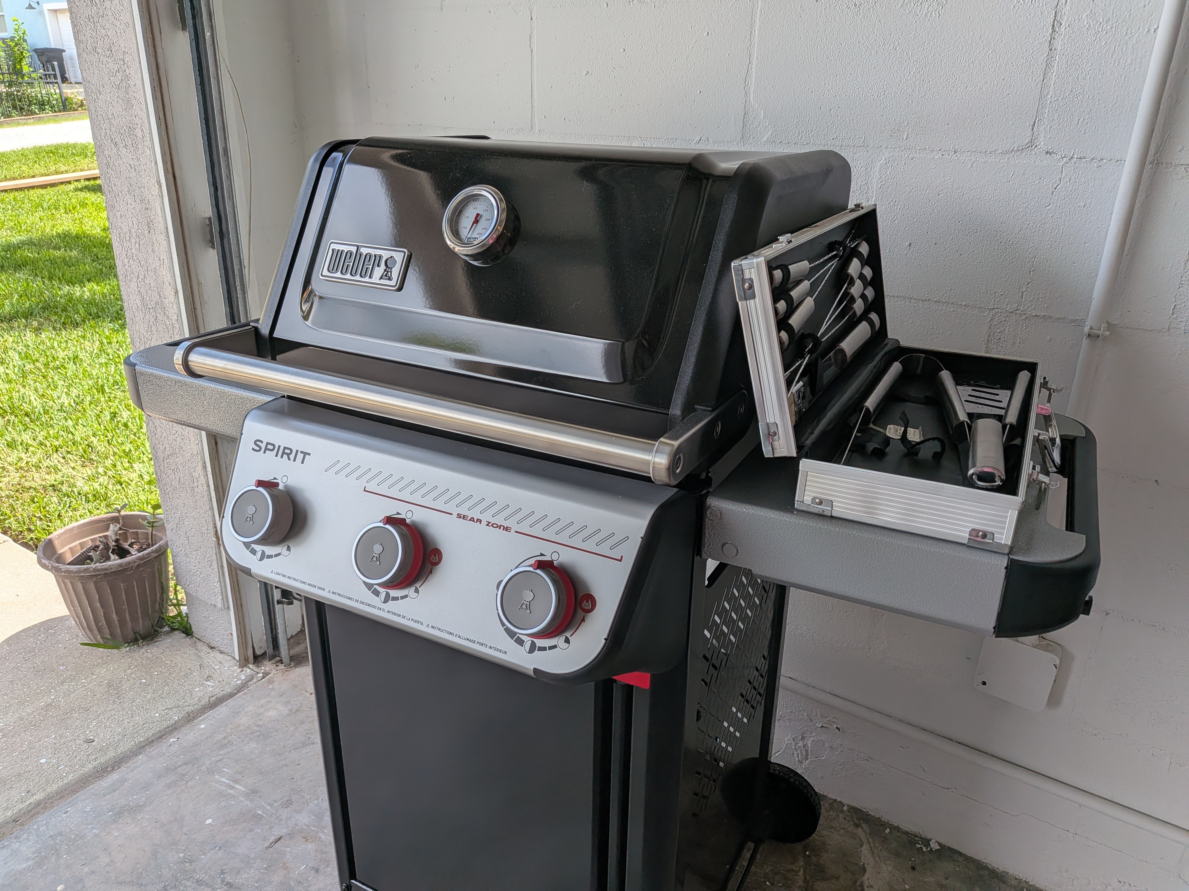 Weber gas grill with prep space for easy outdoor cookouts