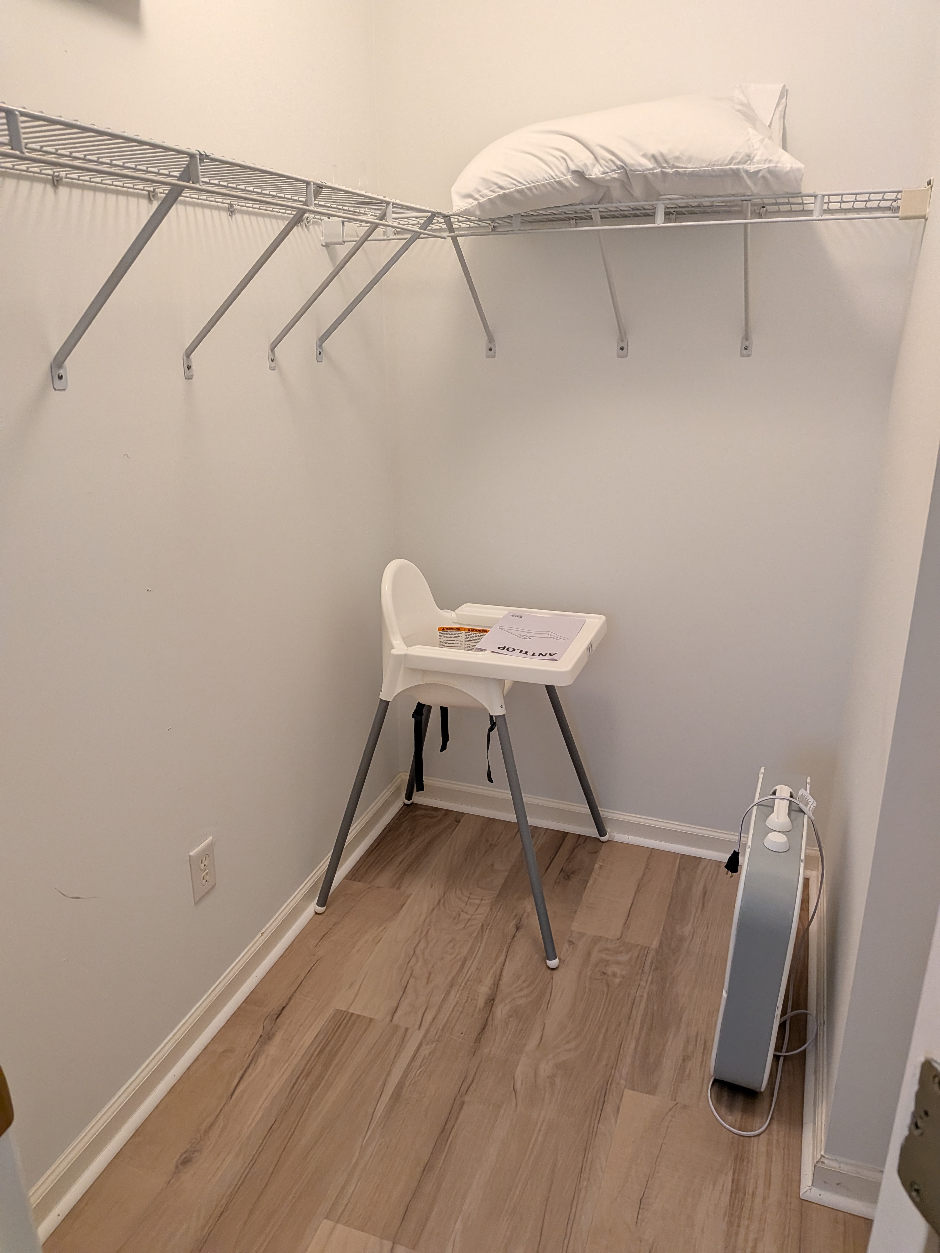 Walk-in closet with generous storage and family-friendly amenities in master bedroom.