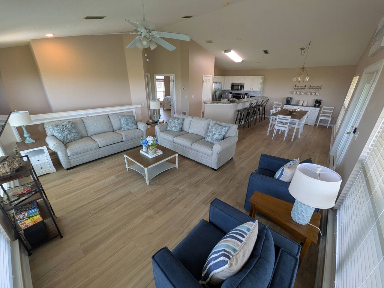 Bright open-concept living space with vaulted ceilings and roomy seating