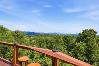 Take in layered ridgelines running toward Grandfather Mountain from the cable-rail deck. Settle into an Adirondack chair or the rail-height bar while the Blue Ridge unfolds for miles.