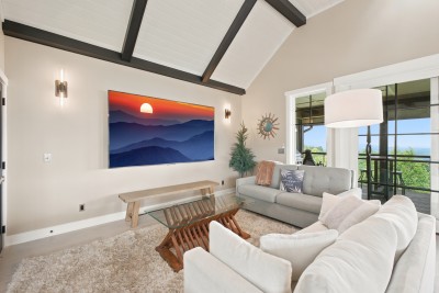 Sink into the sofa with the fire going and the mountains framed in the windows behind you. The TV is there if you want it, but most guests forget about it.