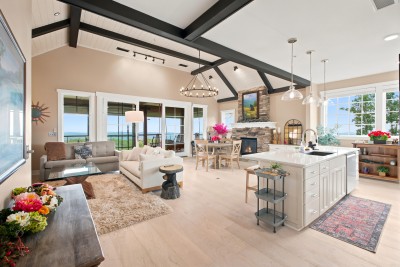 Sightlines run from the kitchen island all the way to the balcony doors, so whoever is cooking is still part of the conversation.